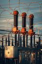 Close-up of high voltage transformers at a power station in Austria during daylight.